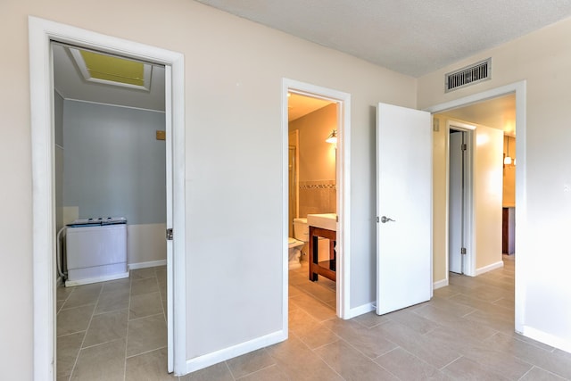 2050 Oleander Blvd Unit 5301, Fort Pierce, FL 34950 - unfurnished bedroom with attic access, tile patterned flooring, and ensuite bathroom