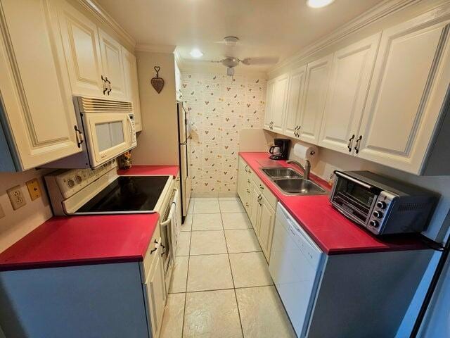 4074 Cornwall D 4074, Boca Raton, FL 33434 - kitchen with white appliances, crown molding, white cabinetry, light tile patterned flooring, and ceiling fan