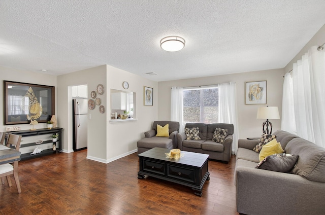363 Sheffield O, West Palm Beach, FL 33417 - living room featuring dark wood-type flooring and a textured ceiling