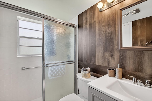 363 Sheffield O, West Palm Beach, FL 33417 - full bathroom with vanity, a stall shower, and wood walls