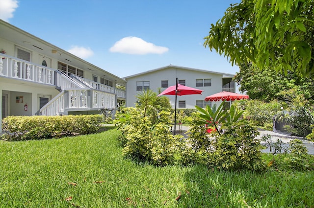 363 Sheffield O, West Palm Beach, FL 33417 - view of grassy yard featuring stairway