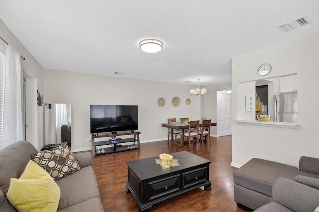 363 Sheffield O, West Palm Beach, FL 33417 - living area with a chandelier, dark wood-type flooring, and a textured ceiling