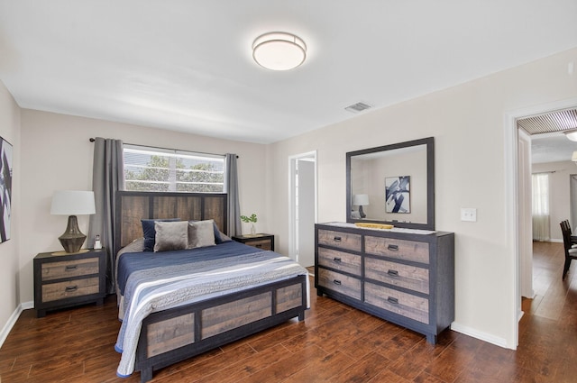 363 Sheffield O, West Palm Beach, FL 33417 - bedroom with multiple windows and dark wood-style flooring