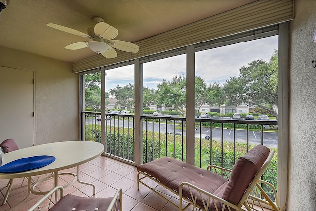 15126 Ashland St Unit 250, Delray Beach, FL 33484 - sunroom / solarium featuring a textured wall, ceiling fan, a water view, tile patterned flooring, and a residential view