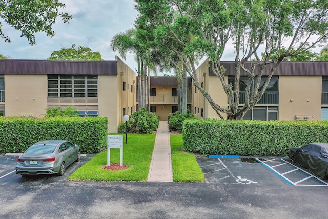 15126 Ashland St Unit 250, Delray Beach, FL 33484 - view of building exterior featuring uncovered parking