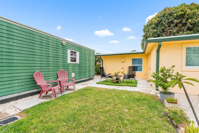 1802 Lake Osborne Dr, Lake Worth Beach, FL 33461 - view of grassy yard with a fire pit and a patio