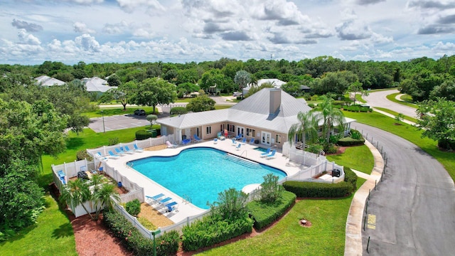 650 NE Waters Edge Ln, Port Saint Lucie, FL 34983 - community pool featuring a patio