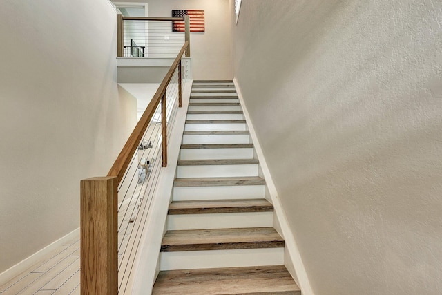 650 NE Waters Edge Ln, Port Saint Lucie, FL 34983 - stairs featuring a towering ceiling and wood finished floors