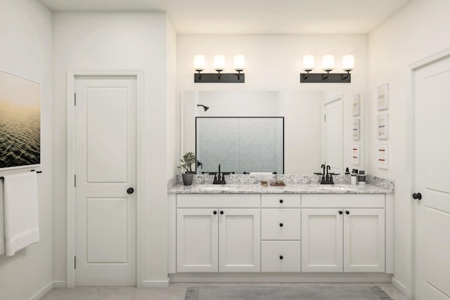 650 NE Waters Edge Ln, Port Saint Lucie, FL 34983 - bathroom with a tile shower and double vanity
