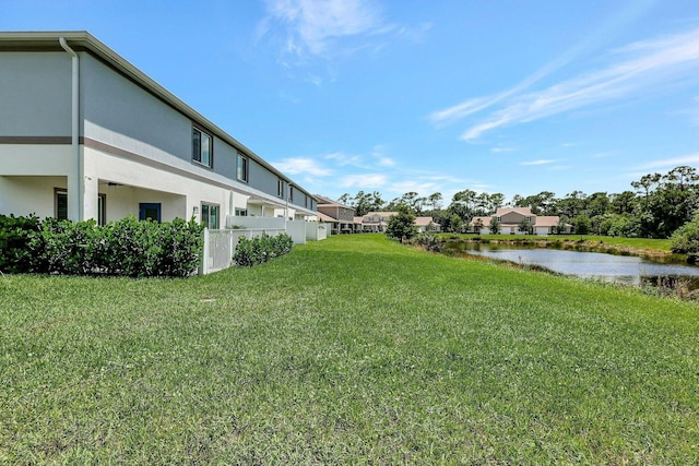 650 NE Waters Edge Ln, Port Saint Lucie, FL 34983 - view of green lawn featuring a water view