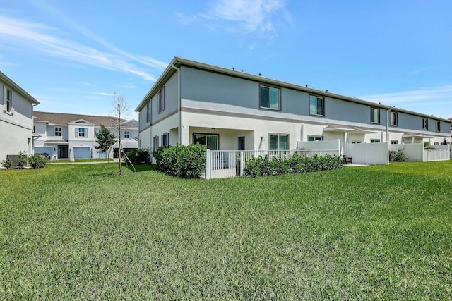 650 NE Waters Edge Ln, Port Saint Lucie, FL 34983 - back of house with stucco siding and a residential view