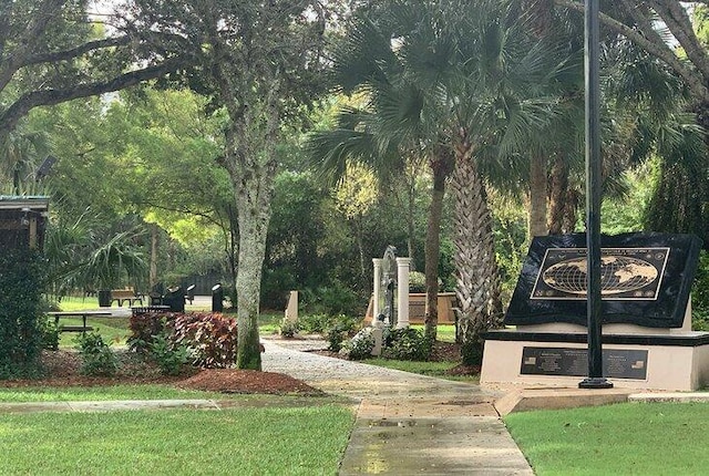 650 NE Waters Edge Ln, Port Saint Lucie, FL 34983 - surrounding community featuring a lawn