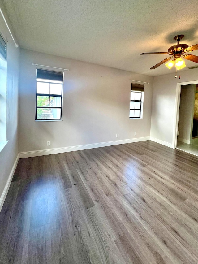 9815 Watermill Cir Unit B, Boynton Beach, FL 33437 - spare room with a textured ceiling, wood finished floors, and a ceiling fan