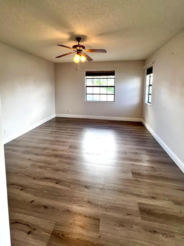 9815 Watermill Cir Unit B, Boynton Beach, FL 33437 - spare room with dark wood-style floors, a textured ceiling, and a ceiling fan