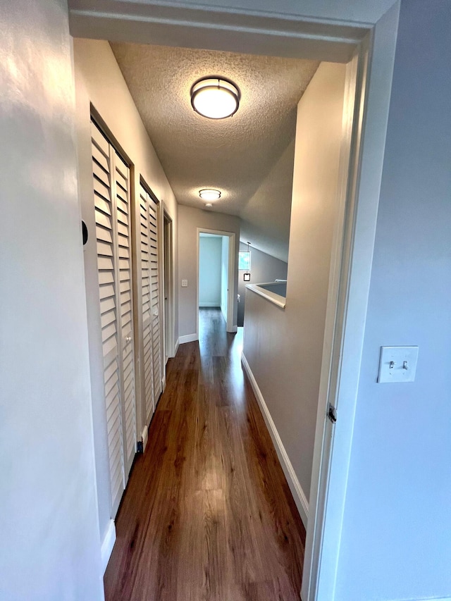 9815 Watermill Cir Unit B, Boynton Beach, FL 33437 - corridor featuring wood finished floors and a textured ceiling