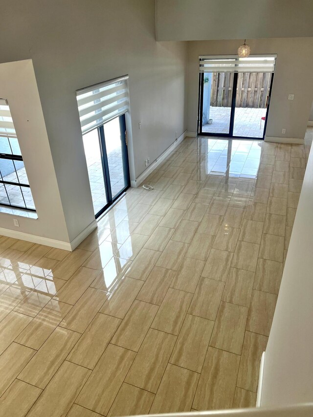 9815 Watermill Cir Unit B, Boynton Beach, FL 33437 - unfurnished room featuring healthy amount of natural light and a chandelier