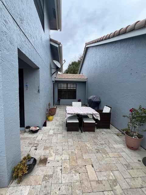 9815 Watermill Cir Unit B, Boynton Beach, FL 33437 - view of patio featuring outdoor dining space