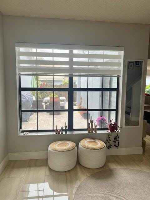 9815 Watermill Cir Unit B, Boynton Beach, FL 33437 - detailed view of baseboards and a textured ceiling