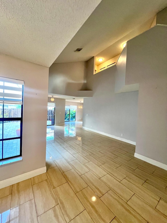 9815 Watermill Cir Unit B, Boynton Beach, FL 33437 - empty room featuring wood tiled floors and a textured ceiling