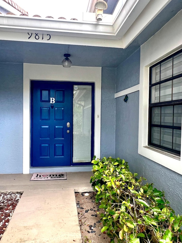 9815 Watermill Cir Unit B, Boynton Beach, FL 33437 - view of exterior entry with stucco siding