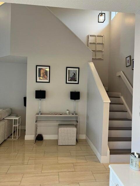9815 Watermill Cir Unit B, Boynton Beach, FL 33437 - staircase with baseboards
