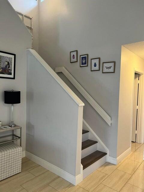 9815 Watermill Cir Unit B, Boynton Beach, FL 33437 - stairway with baseboards and wood finished floors