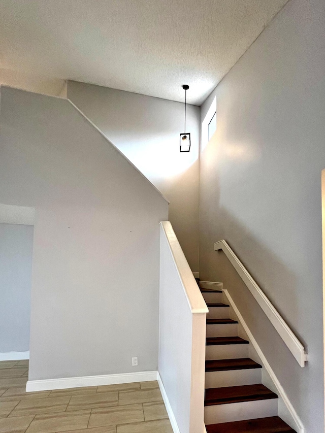 9815 Watermill Cir Unit B, Boynton Beach, FL 33437 - stairs with a textured ceiling and baseboards