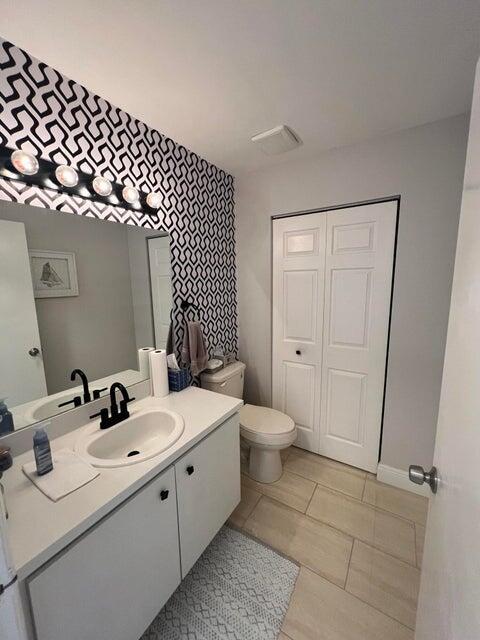 9815 Watermill Cir Unit B, Boynton Beach, FL 33437 - bathroom featuring vanity and tile patterned flooring