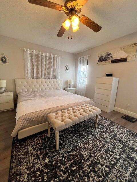 9815 Watermill Cir Unit B, Boynton Beach, FL 33437 - bedroom with wood finished floors and a ceiling fan