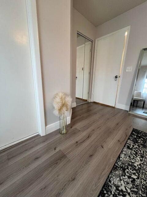 9815 Watermill Cir Unit B, Boynton Beach, FL 33437 - hall featuring wood finished floors and baseboards