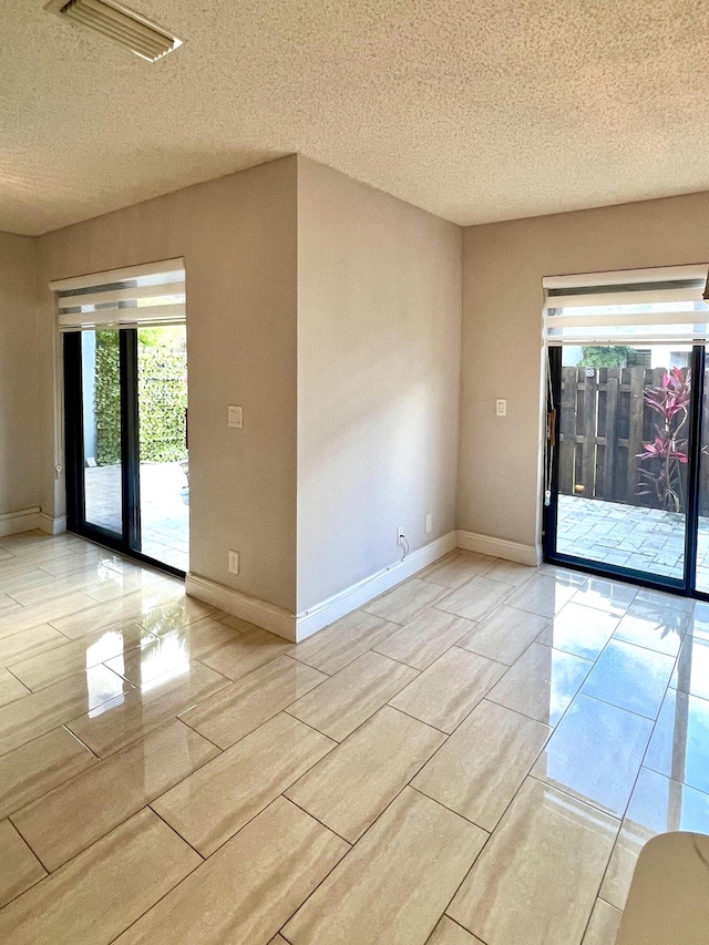 9815 Watermill Cir Unit B, Boynton Beach, FL 33437 - unfurnished room featuring a textured ceiling and baseboards