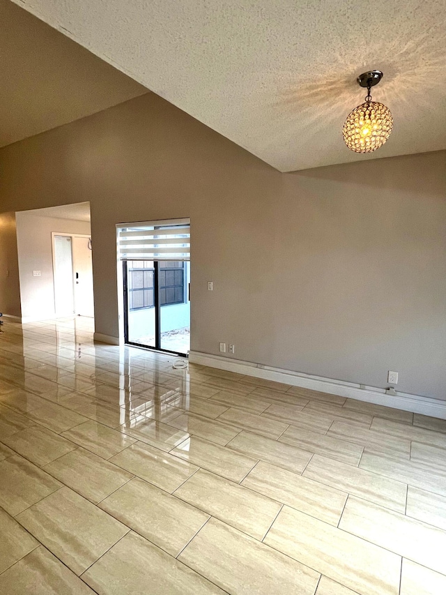 9815 Watermill Cir Unit B, Boynton Beach, FL 33437 - spare room featuring lofted ceiling and baseboards