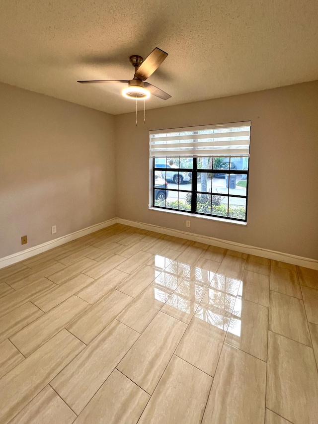 9815 Watermill Cir Unit B, Boynton Beach, FL 33437 - unfurnished room with a textured ceiling and ceiling fan