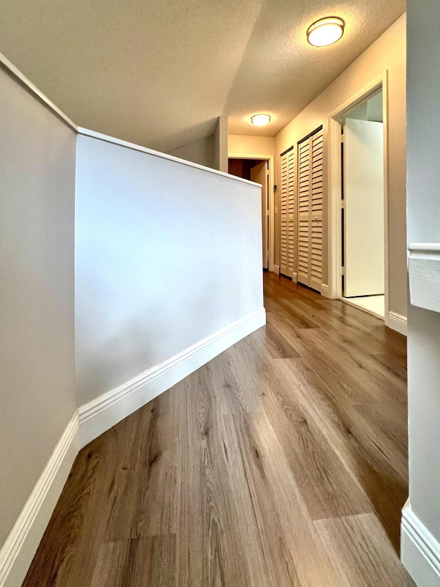 9815 Watermill Cir Unit B, Boynton Beach, FL 33437 - hall featuring wood finished floors and a textured ceiling