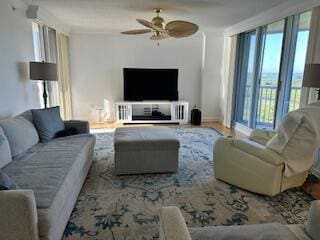 5049 N A1A Unit 1901, Hutchinson Island, FL 34949 - living area with a ceiling fan