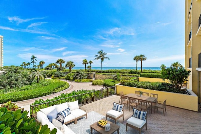 300 Ocean Trail Way Unit 102, Jupiter, FL 33477 - view of patio with an outdoor living space, a water view, and outdoor dining space