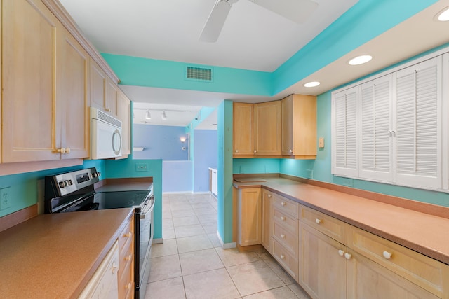 300 Ocean Trail Way Unit 102, Jupiter, FL 33477 - kitchen featuring white microwave, stainless steel range with electric stovetop, light tile patterned flooring, light brown cabinets, and recessed lighting