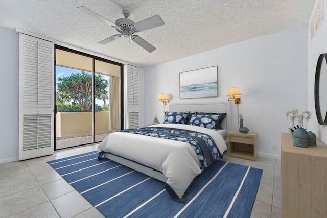 300 Ocean Trail Way Unit 102, Jupiter, FL 33477 - tiled bedroom with access to outside, a textured ceiling, ceiling fan, and expansive windows