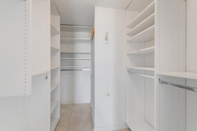 300 Ocean Trail Way Unit 102, Jupiter, FL 33477 - spacious closet with light tile patterned floors