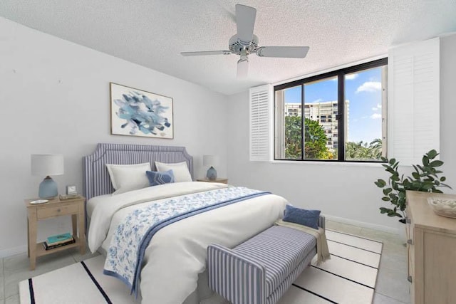 300 Ocean Trail Way Unit 102, Jupiter, FL 33477 - bedroom featuring a textured ceiling, ceiling fan, and light tile patterned floors
