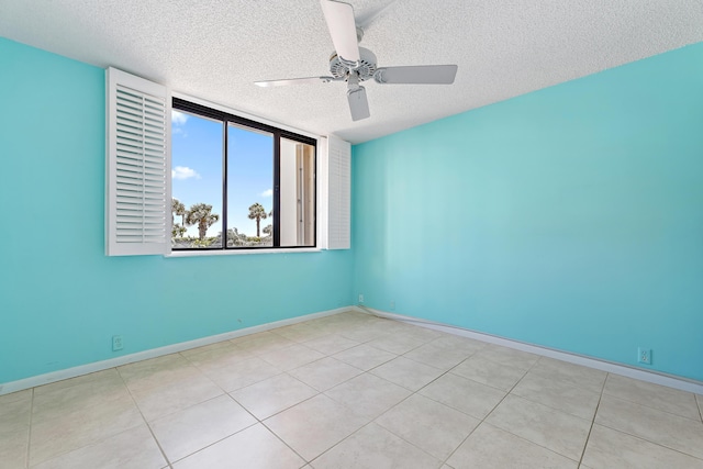 300 Ocean Trail Way Unit 102, Jupiter, FL 33477 - empty room with a textured ceiling, ceiling fan, and tile patterned floors