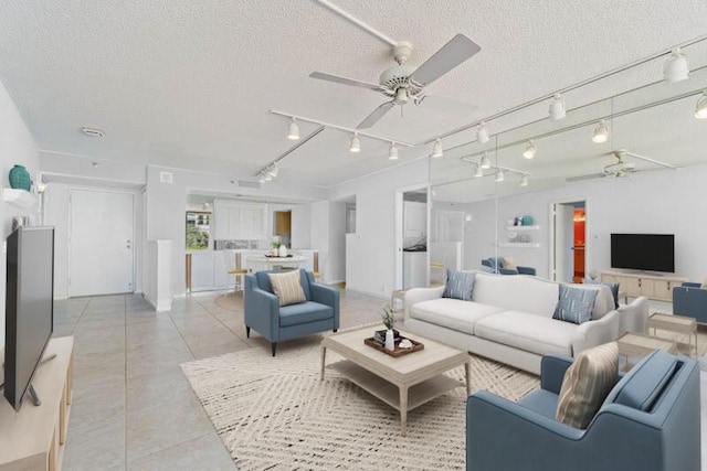 300 Ocean Trail Way Unit 102, Jupiter, FL 33477 - living area with a ceiling fan, a textured ceiling, rail lighting, and light tile patterned flooring