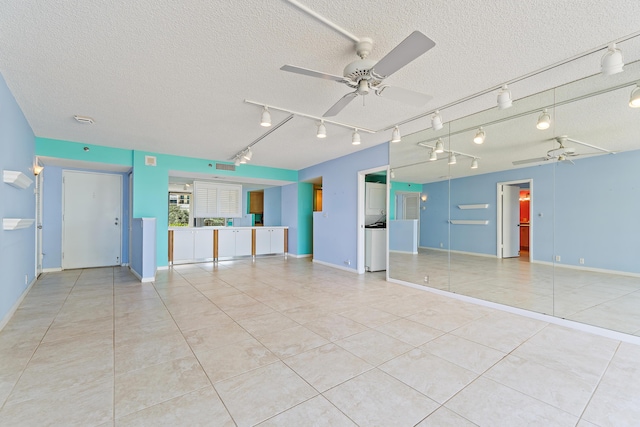 300 Ocean Trail Way Unit 102, Jupiter, FL 33477 - unfurnished room with light tile patterned floors, a ceiling fan, a textured ceiling, and track lighting