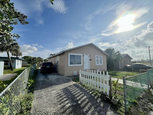 628 W 7th St, Riviera Beach, FL 33404 - bungalow with stucco siding and concrete driveway