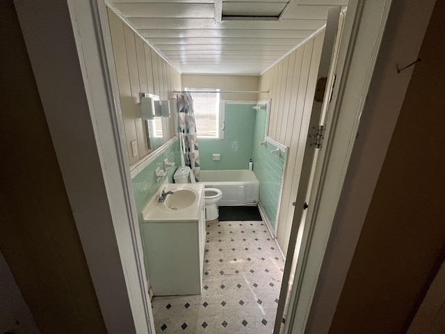 628 W 7th St, Riviera Beach, FL 33404 - full bath featuring tile patterned floors, vanity, and shower / bath combo with shower curtain