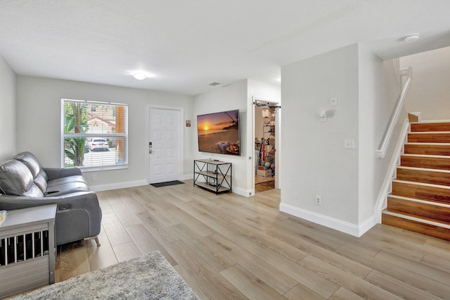 8730 SW 21st St, Miramar, FL 33025 - living room featuring light wood-type flooring and stairway