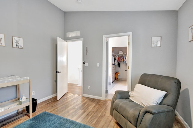 8730 SW 21st St, Miramar, FL 33025 - living area featuring light wood-style flooring and high vaulted ceiling