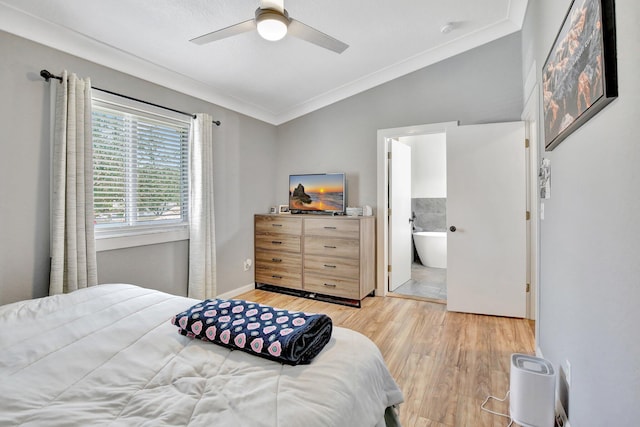 8730 SW 21st St, Miramar, FL 33025 - bedroom with ornamental molding, vaulted ceiling, light wood-style floors, a ceiling fan, and ensuite bath