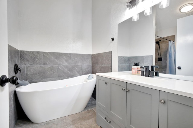 8730 SW 21st St, Miramar, FL 33025 - bathroom featuring tile walls, vanity, a freestanding bath, wainscoting, and a shower with curtain