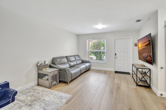 8730 SW 21st St, Miramar, FL 33025 - living room featuring light wood-style flooring and baseboards